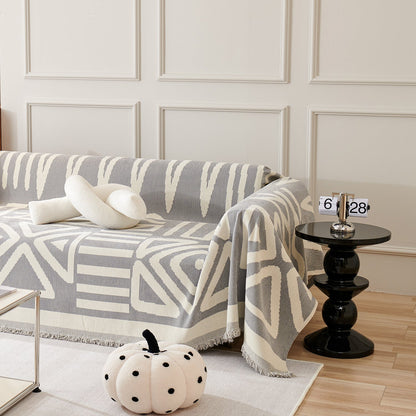 Copridivano d’Ispirazione Boho con Disegni Geometrici e Dettagli Eleganti