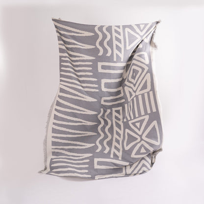 Copridivano d’Ispirazione Boho con Disegni Geometrici e Dettagli Eleganti