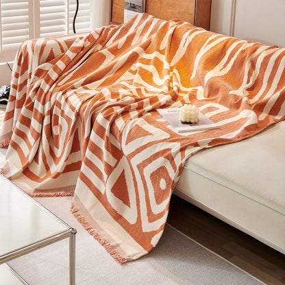 Copridivano d’Ispirazione Boho con Disegni Geometrici e Dettagli Eleganti