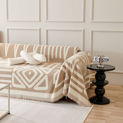 Copridivano d’Ispirazione Boho con Disegni Geometrici e Dettagli Eleganti
