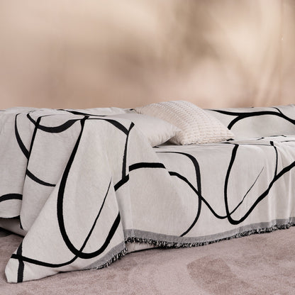 Copridivano d’Ispirazione Boho con Disegni Geometrici e Dettagli Eleganti